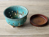 Functional ceramic fruit bowl with holes for rinsing berries