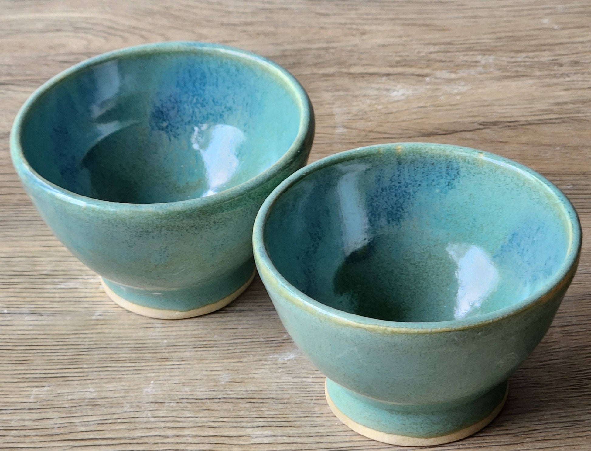 Rustic stoneware spice bowl with glossy green-blue finish