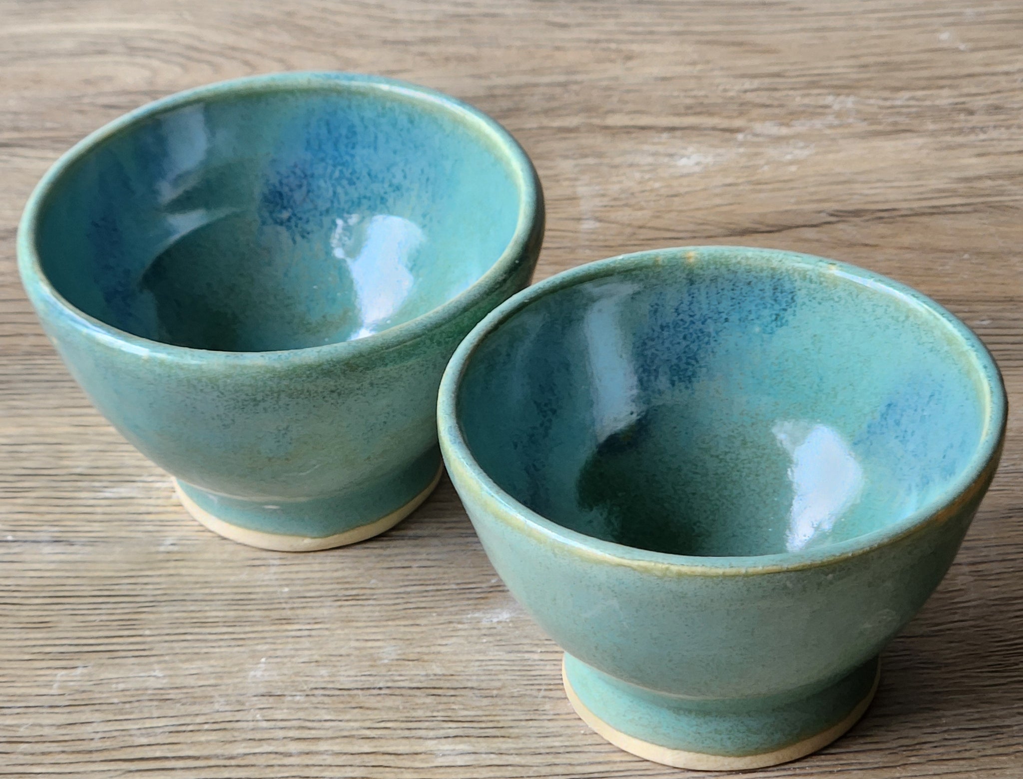 Rustic stoneware spice bowl with glossy green-blue finish