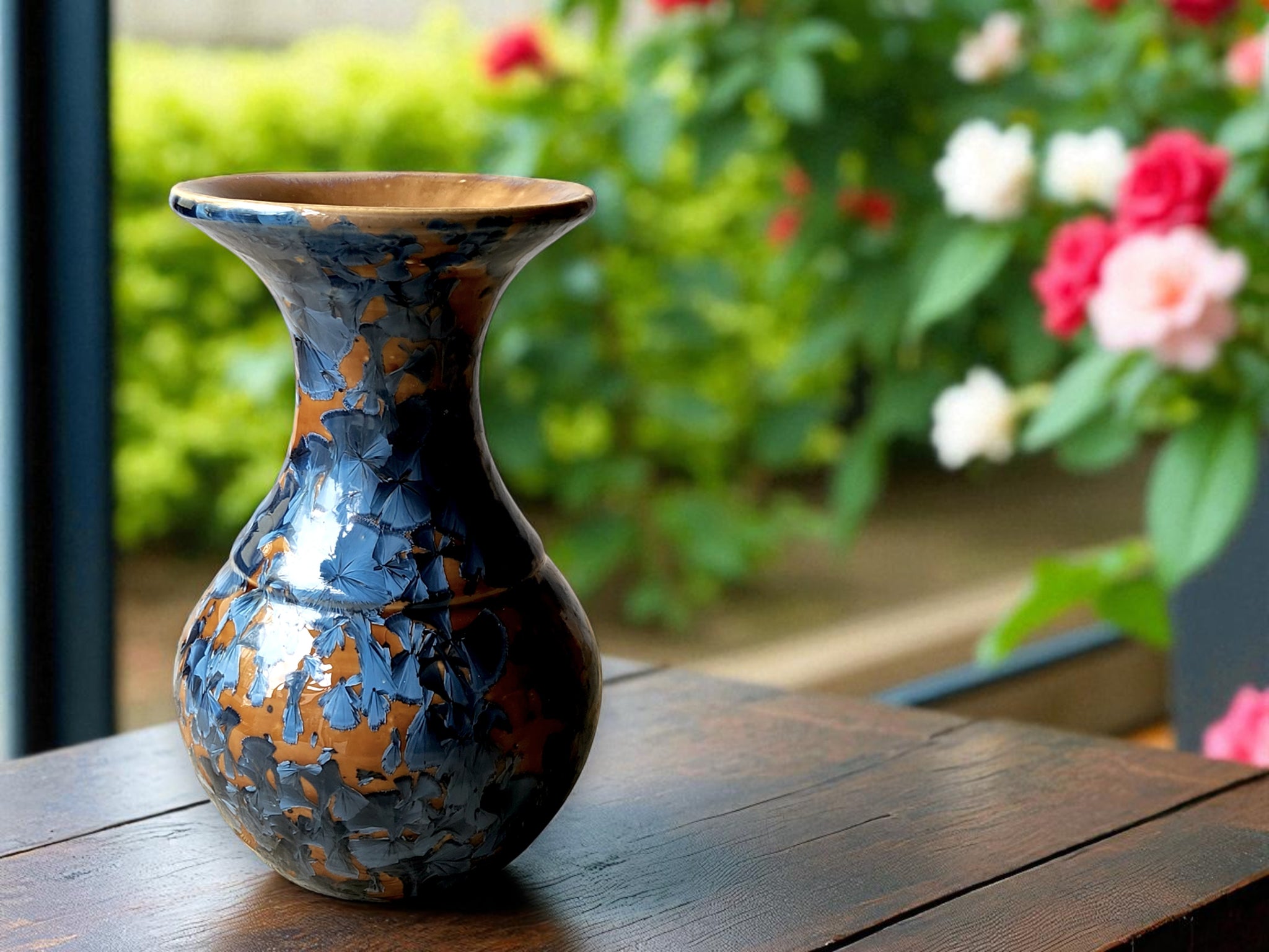 Handmade ceramic vase with blue crystalline glaze