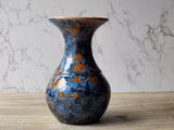 Wheel-thrown porcelain vase in orange and blue glaze