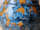 Orange ceramic vase with blue crystal patterns