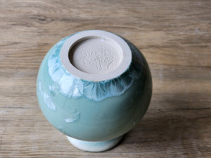 Bottom  of a One-of-a-kind crystalline ceramic flower vase