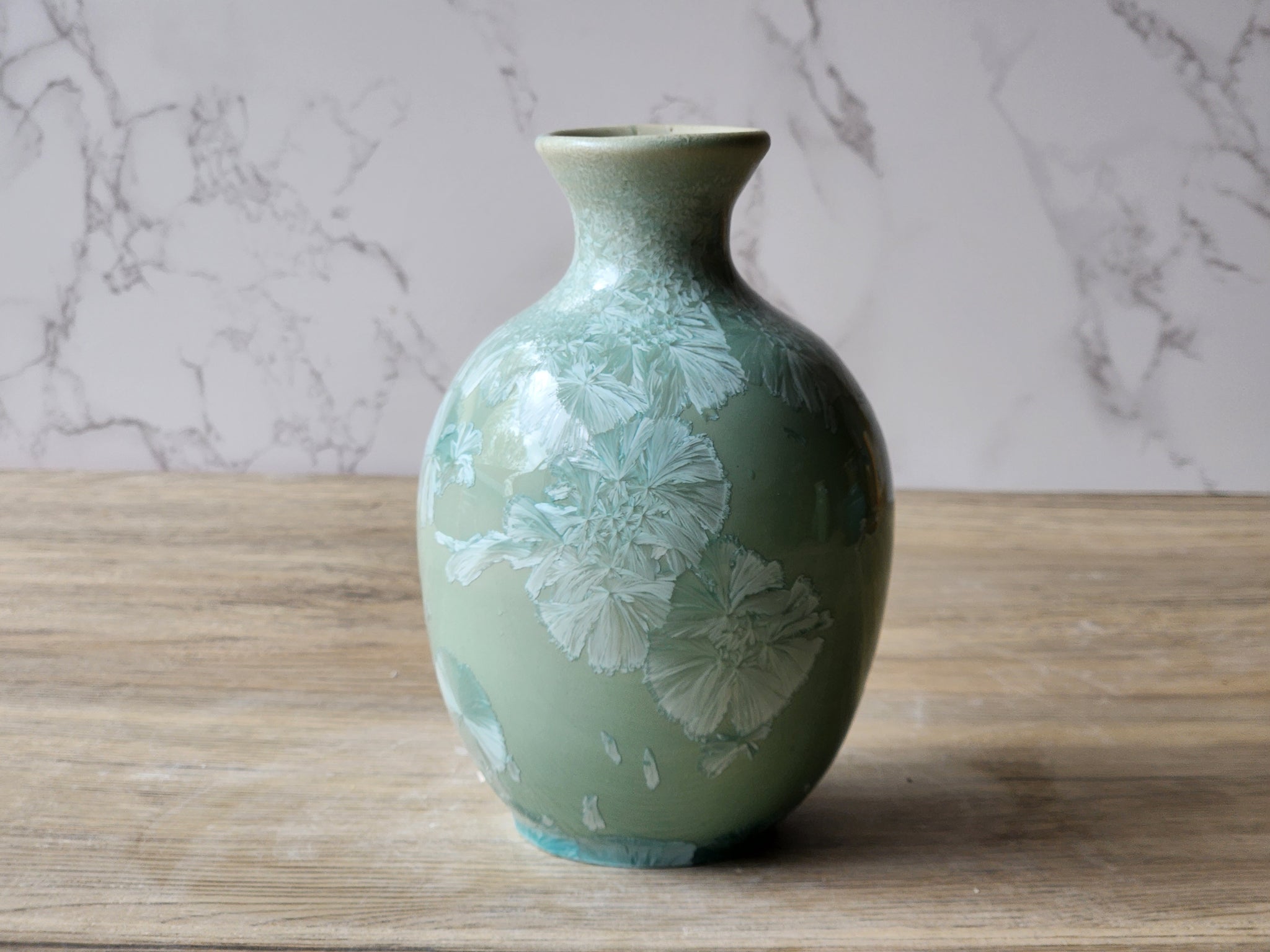 Small Australian pottery vase with a soft blue glaze