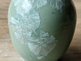 Porcelain vase with soft blue crystal patterns shown up close