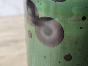 Close up of crystal formation on Unique green ceramic art vase made in Australia