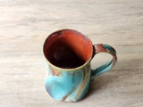 Red‑brown interior ceramic coffee cup