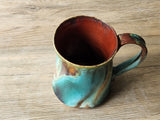Hand‑made stoneware mug on wooden table - made in Melbourne studios of Buxton Pottery