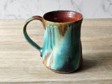 Side view of rustic ceramic mug