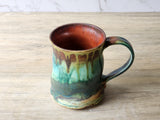 Rustic artisan mug handmade in Melbourne – turquoise, brown, and amber hues