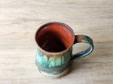 One‑of‑a‑kind handmade coffee mug with earthy tones and glaze movement