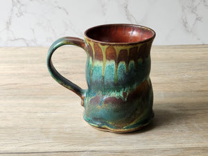 Wheel‑thrown ceramic mug with altered shape and textured base