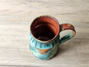 Australian handmade mug in green and rust tones