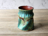 Handmade coffee mug with ergonomic handle and bold glaze