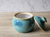 Studio pottery sugar bowl with glossy white interior
