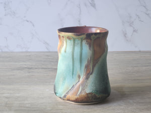 Handmade coffee mug with ergonomic handle and bold glaze