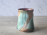 Handmade coffee mug with ergonomic handle and bold glaze