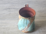 Australian handmade mug in green and rust tones