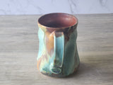 Artisan ceramic cup showing rustic glaze detail  inspired by the Australian landscape.