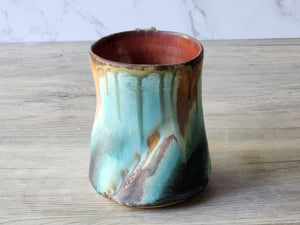 Red-brown glazed interior of ceramic mug