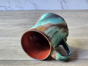Artisan ceramic mug with twisted shape