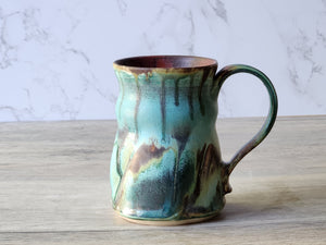 Detail of glaze texture on handcrafted ceramic drinking mug