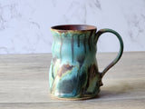 Detail of glaze texture on handcrafted ceramic drinking mug