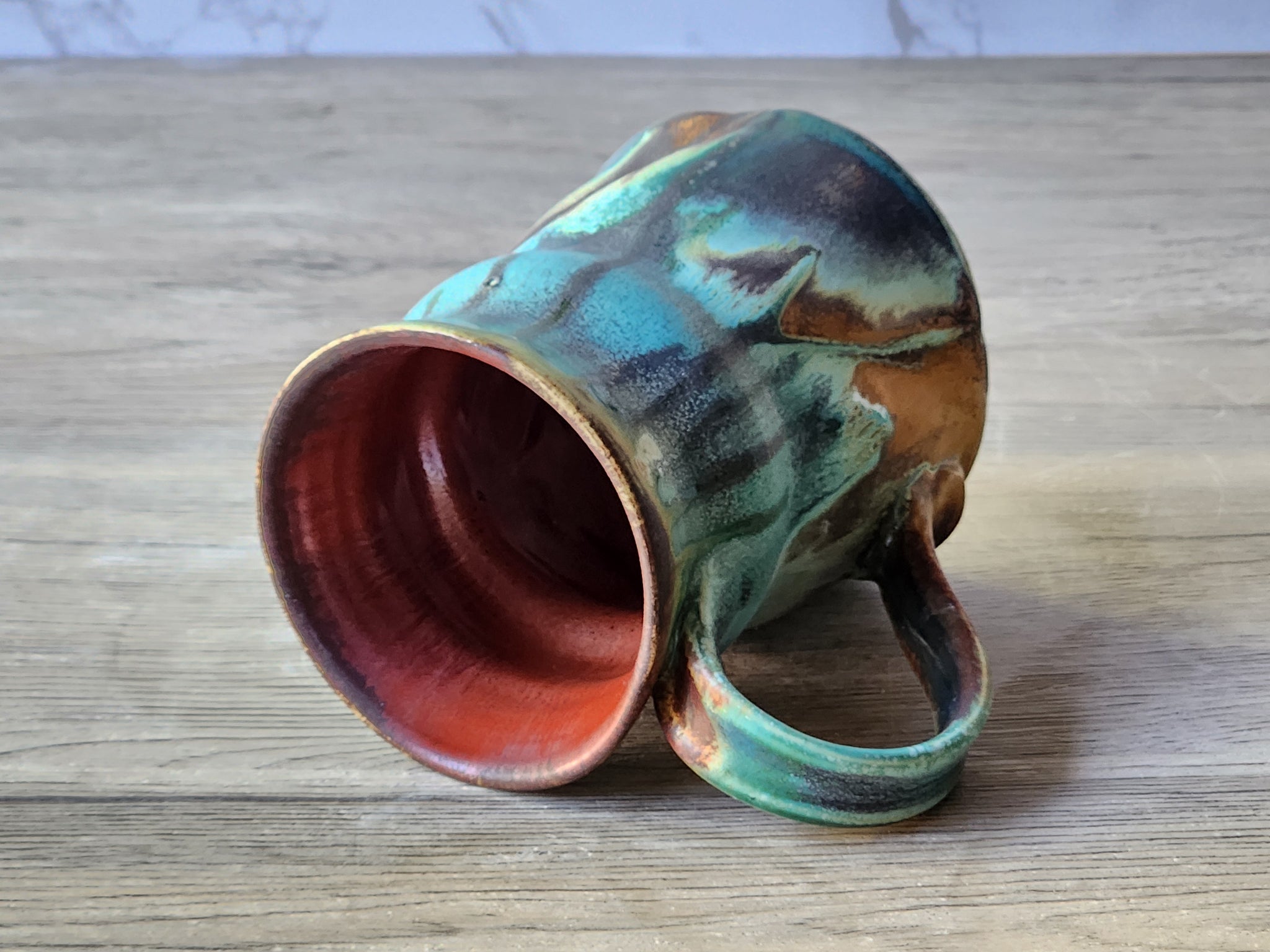 Unique hand-thrown stoneware mug with earthy glaze tones