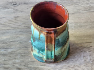 Interior view of red-glazed ceramic mug