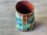 Interior view of red-glazed ceramic mug
