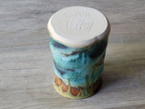 Under side of Unique handcrafted mug in ocean and earth tones