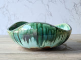 Green and brown glaze detail inside handmade pottery bowl, from our Melbourne studio.