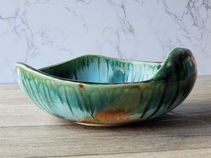 Artisan stoneware bowl with earthy glaze variations