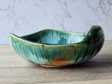 Artisan stoneware bowl with earthy glaze variations
