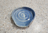 Mid blue spoon rest with a spiral pattern