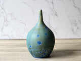 Wheel-thrown ceramic vase with blue glaze