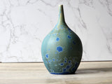 Blue crystal detail on sage green ceramic vase