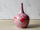 Artisan vase with red glaze and white crystals
