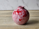 Side view of red crystal-glazed bud vase