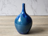 Wheel-thrown blue porcelain vase with crystals