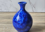 Artistic vase with brilliant blue crystal growth