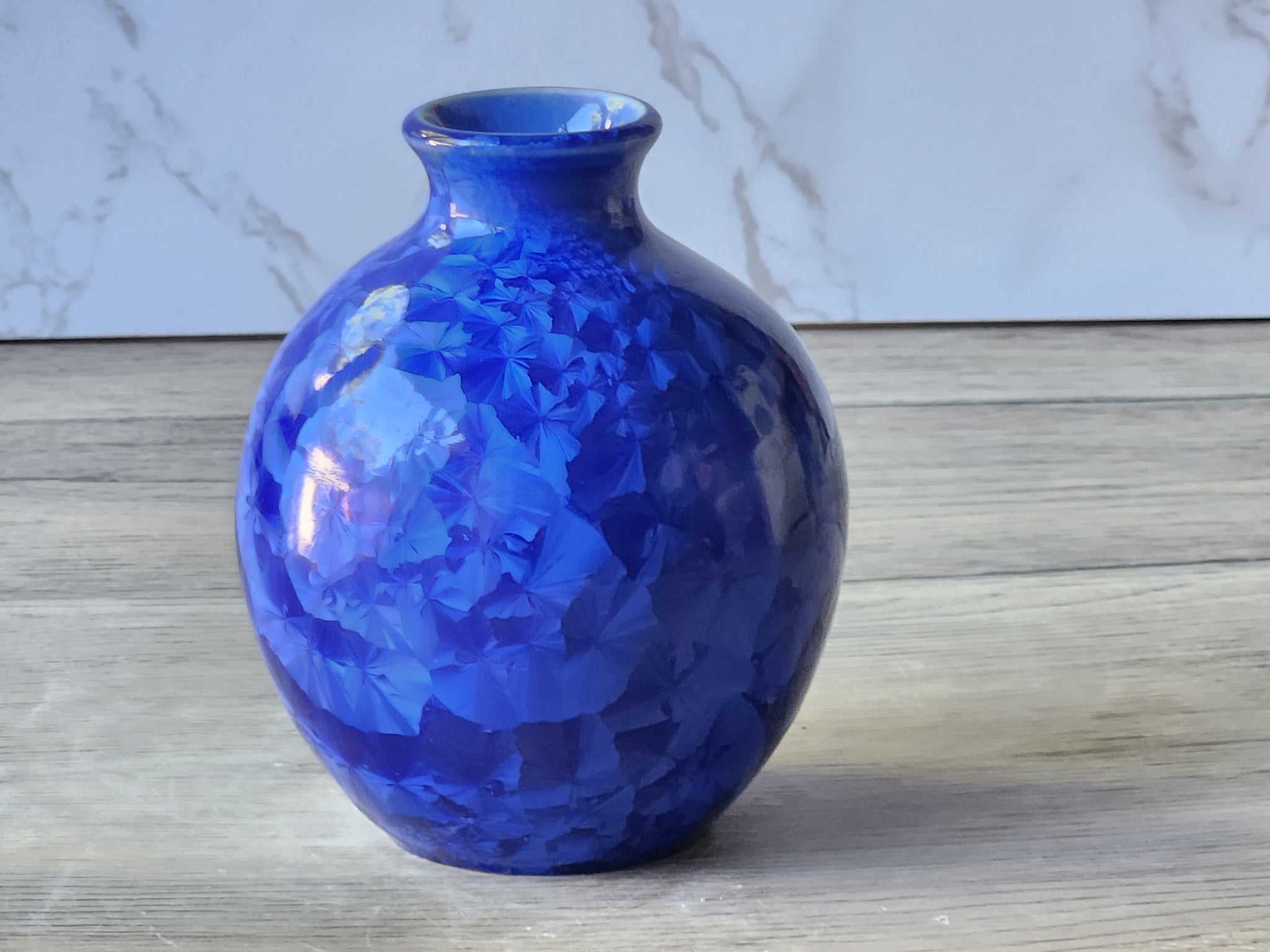 Handmade cobalt blue bottle vase with rounded belly and narrow neck