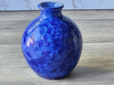 Hand-thrown ceramic vase with deep blue crystalline surface