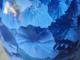 Close up of crystals on a crystalline glaze pottery blue vase