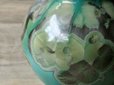 Close up crystalline glaze formation green ceramic vase