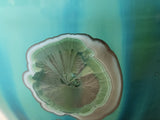 Detail of green crystals with metallic outer ring pottery