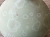 Close up crystalline glaze detail on mint pottery vase
