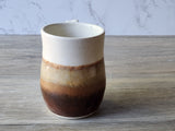 Handmade ceramic mug with earthy layered glaze and curved handle, Australian pottery made in Melbourne