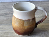 Extra large handmade stoneware mug with cream and brown glaze, wheel-thrown ceramic coffee mug