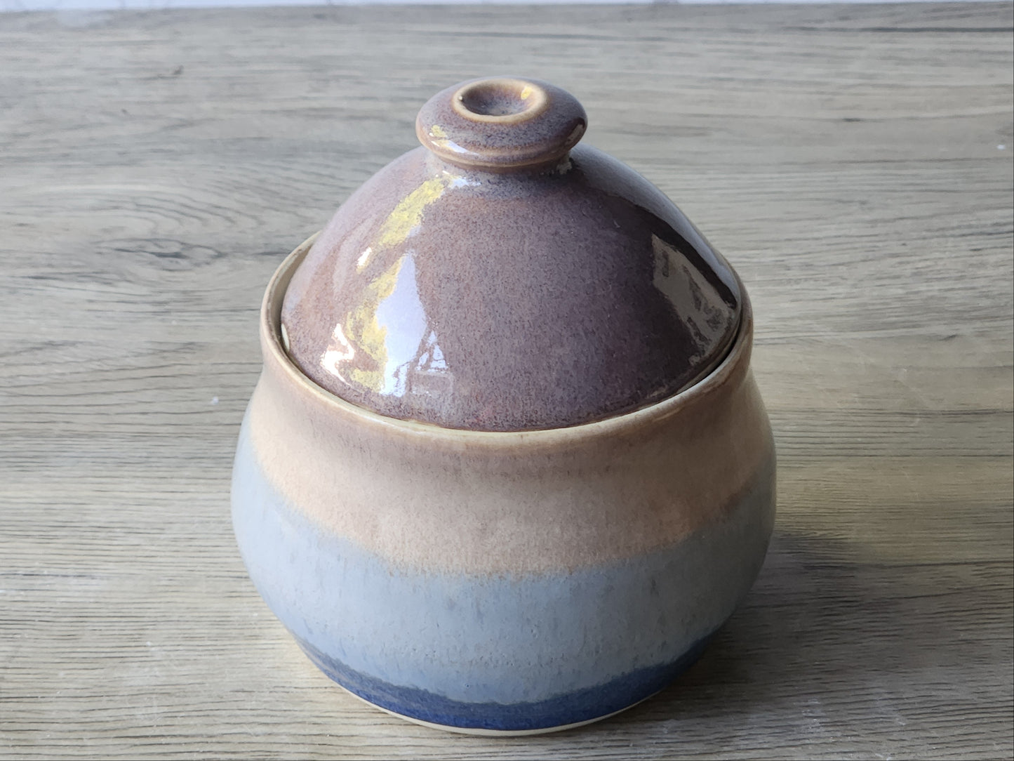 Handcrafted ceramic sugar bowl with domed lid in blue and neutral tones